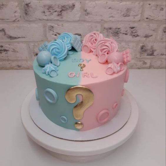 “Welcome to the World” cake with globe and baby accessories
