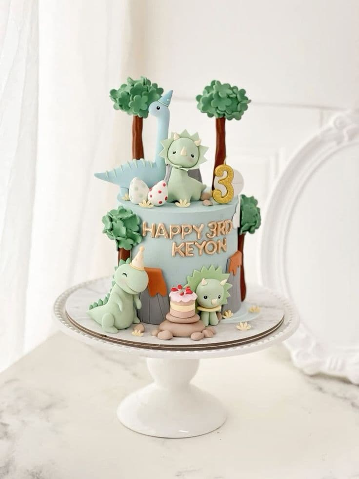 Single-tier dark chocolate truffle birthday cake with dinosaurs' glaze.