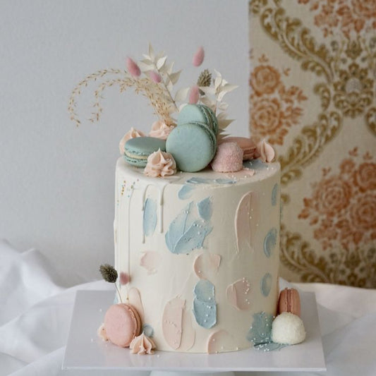 “Baby in Bloom” cake with floral and baby elements combined