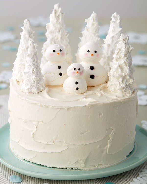 “Winter Wonderland Cake” featuring icy blue tones and snowflake accents