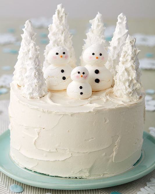 “Winter Wonderland Cake” featuring icy blue tones and snowflake accents